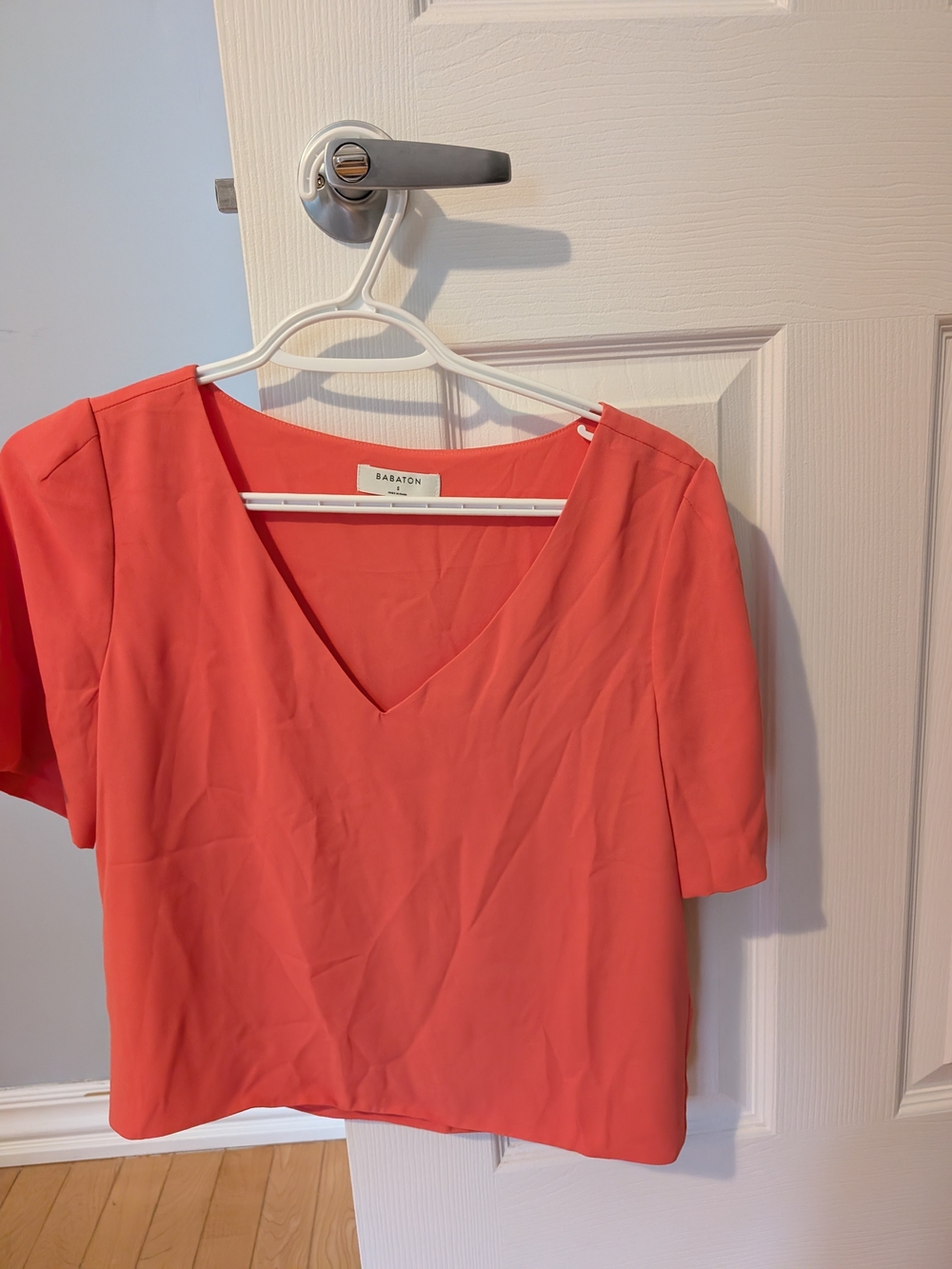 Babaton Coral V-Neck Blouse in Vibrant Coral